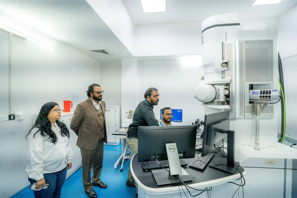Managing Director Shafiulla H N and the team at an analytical instrument, reading its monitor