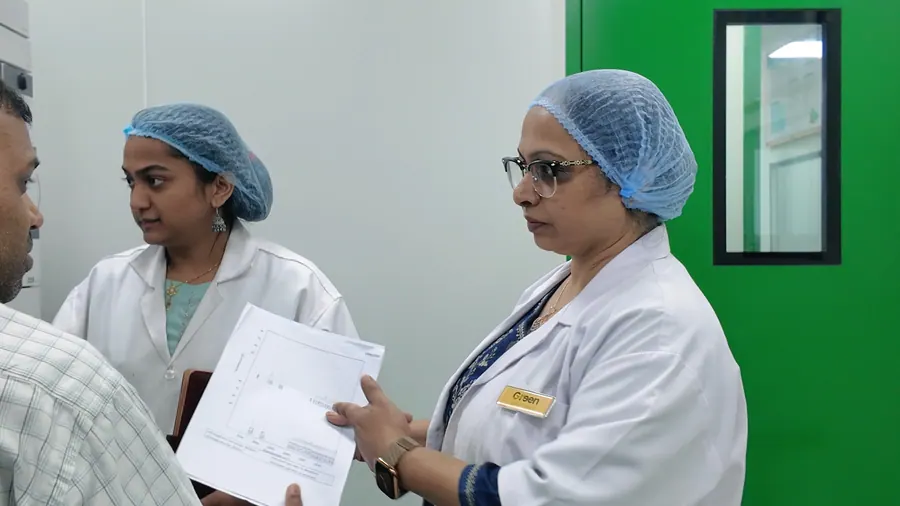 Scientists discussing a chromatogram printout