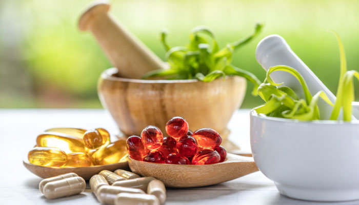 Capsules and supplements arranged on a surface