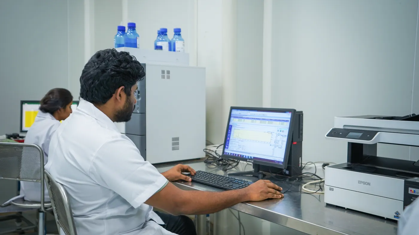 An analyst reviewing a chromatogram in the GreenSpace Herbs laboratory